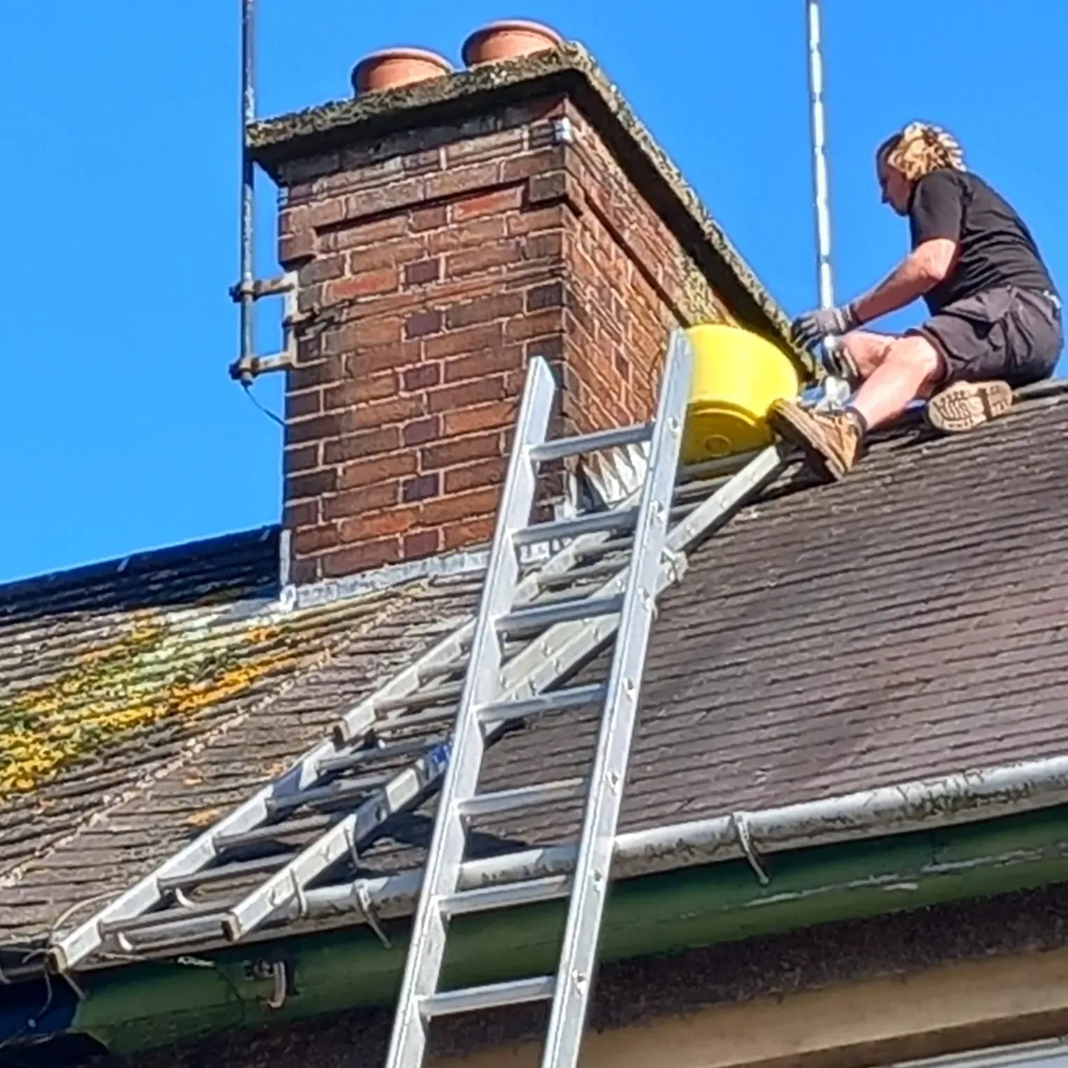 5 Star Roofing Leicester roofer repairing a chimney and tiled roof in Leicestershire.